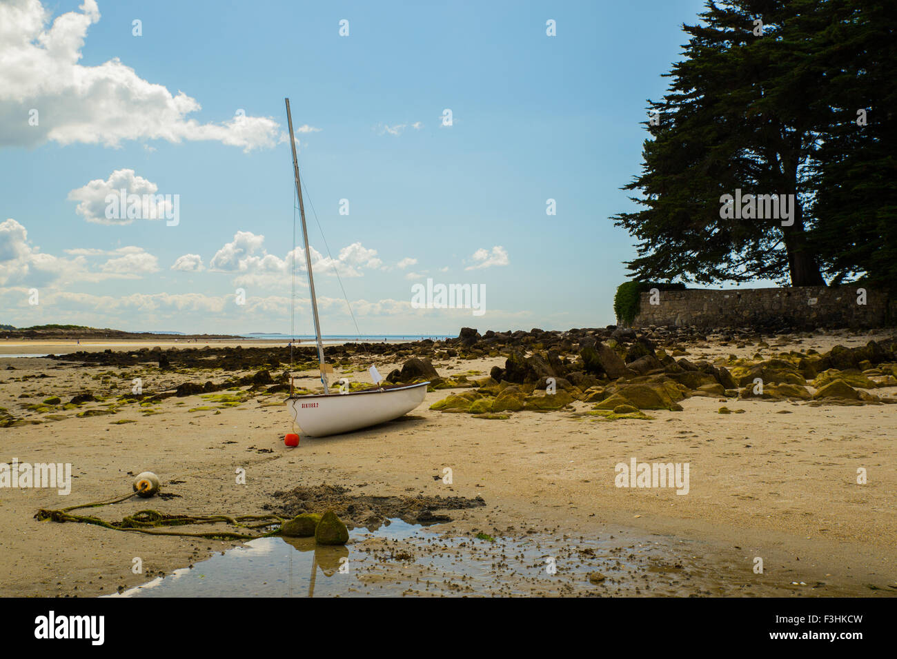 Boat on the beach at Carnac. Stock Photo
