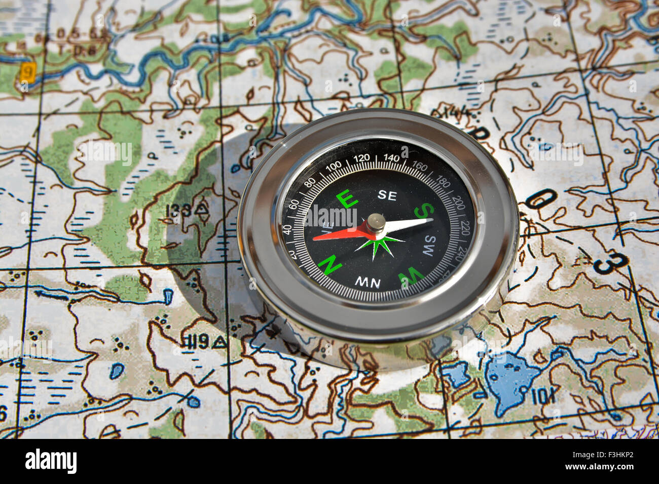 Magnetic compass is located on a topographic map. Navigation: a compass ...