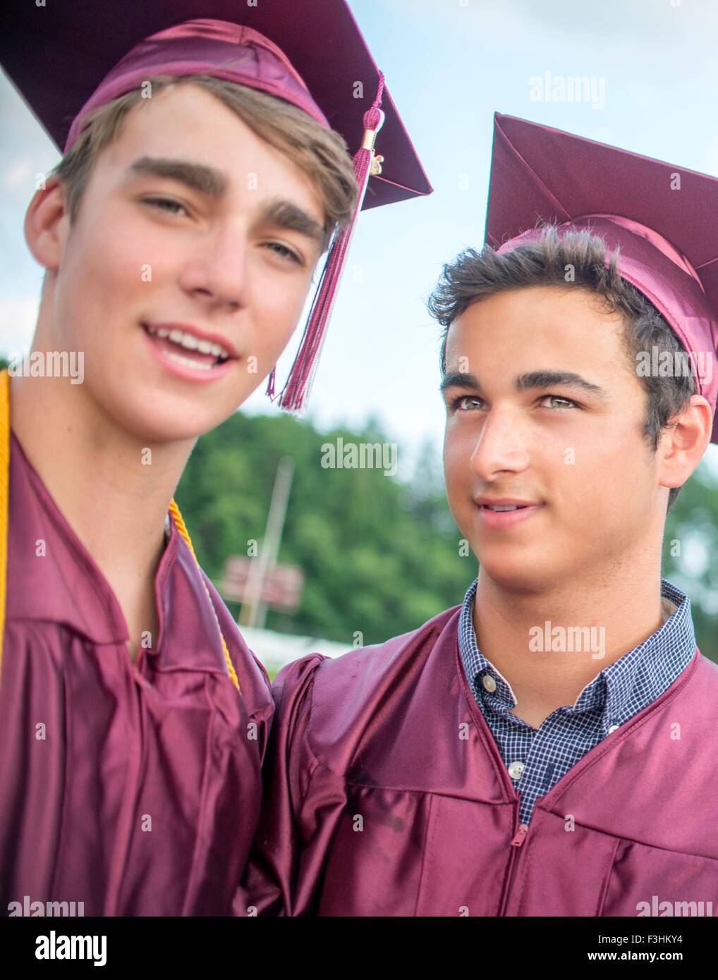 Portrait of two young men at graduation ceremony Stock Photo