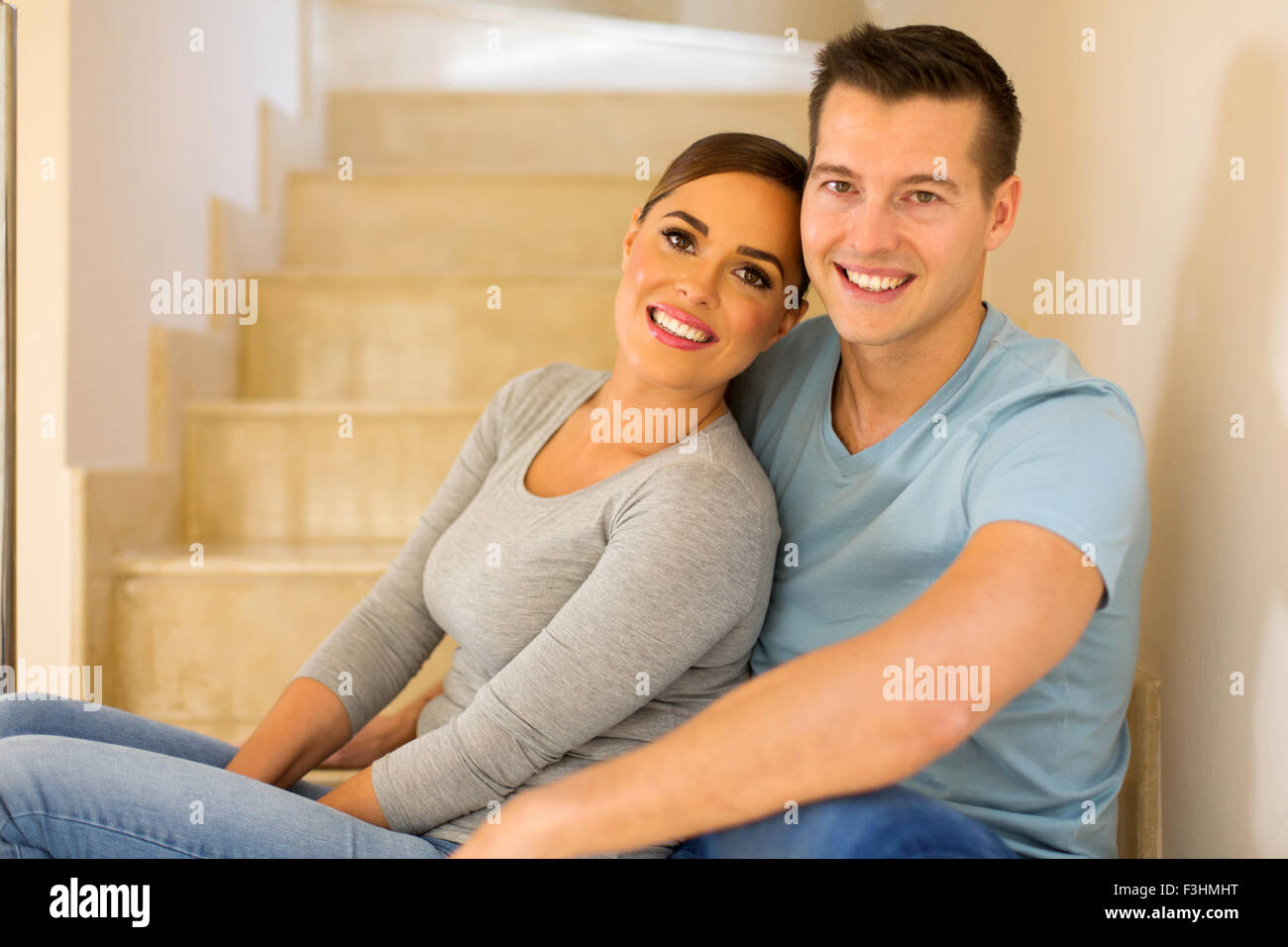 Family sitting on stairs hi-res stock photography and images - Alamy