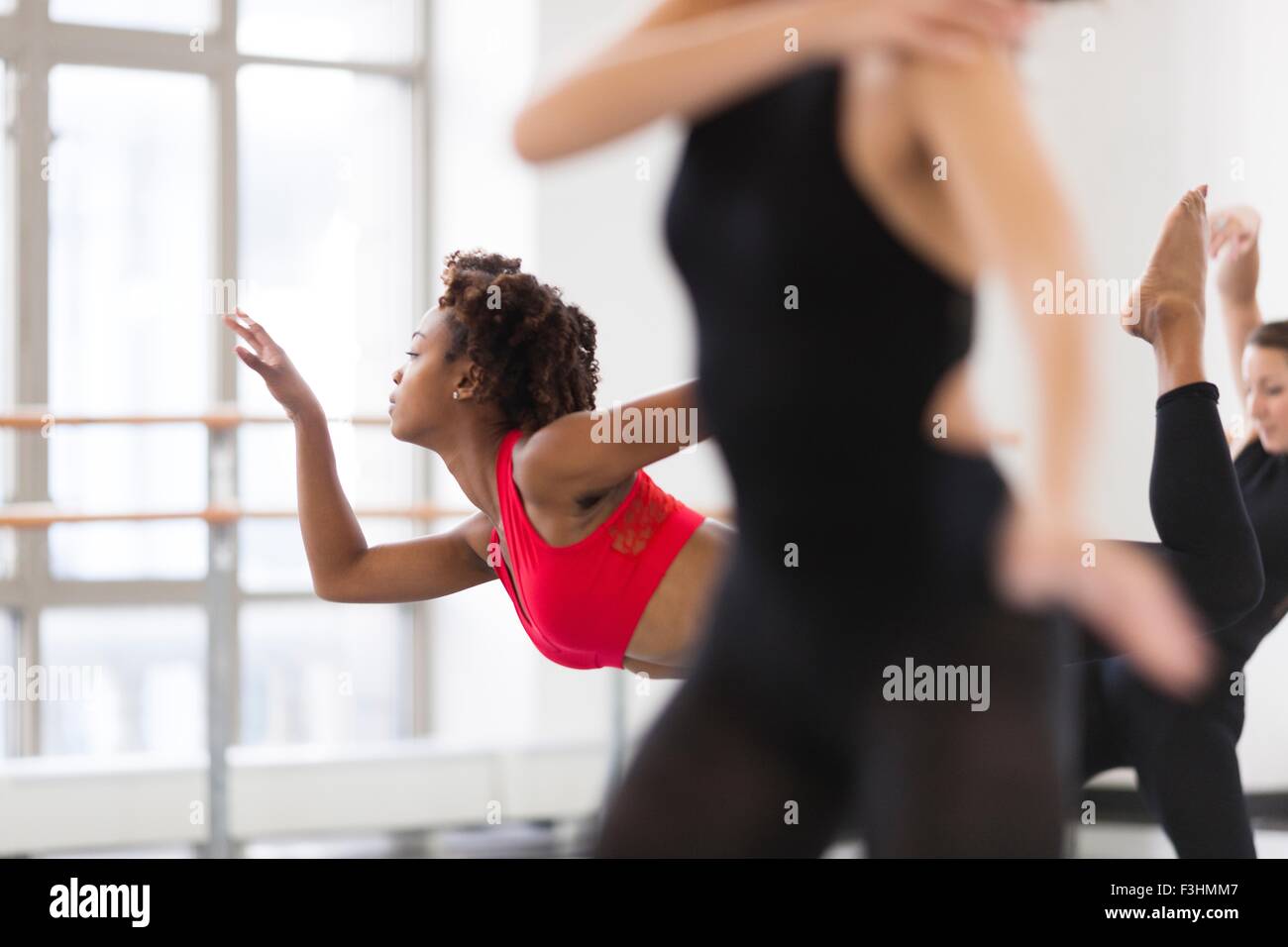 Young women in dance studio dancing, differential focus Stock Photo
