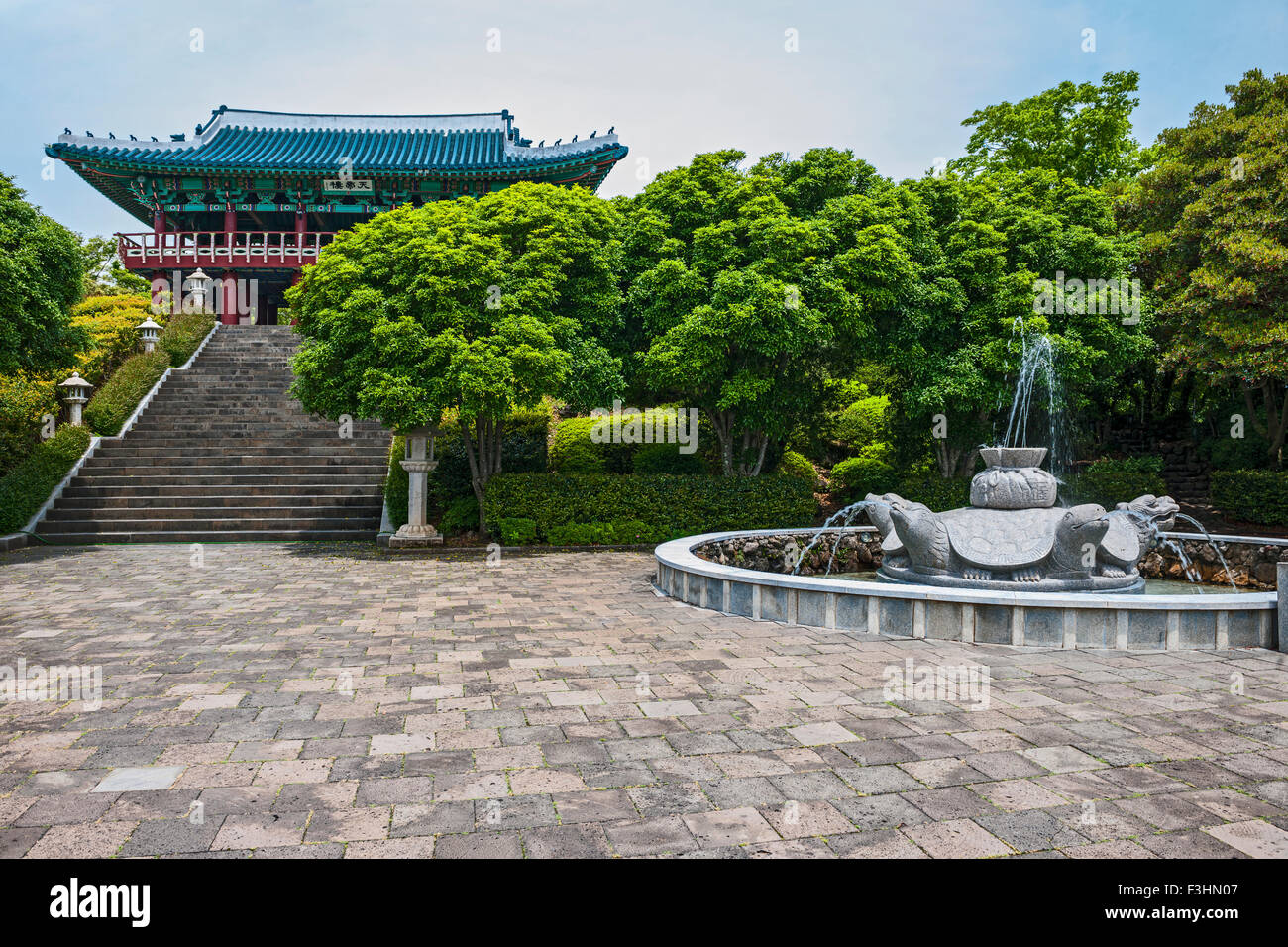 Temple at Cheonjeyeon falls on Jeju Island Stock Photo