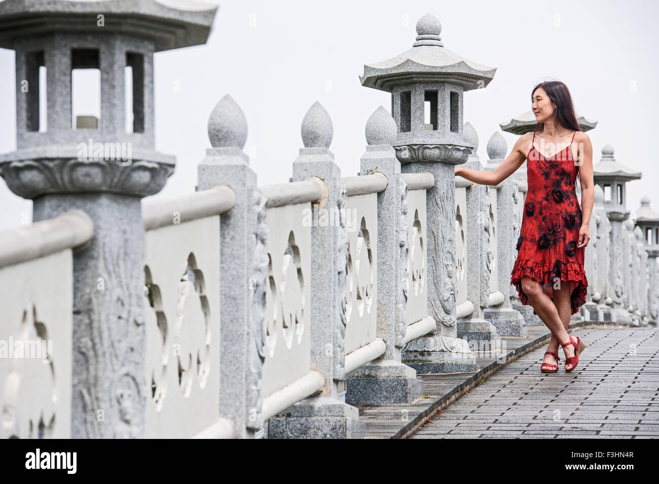 Woman standing a bridge hi-res stock photography and images - Alamy