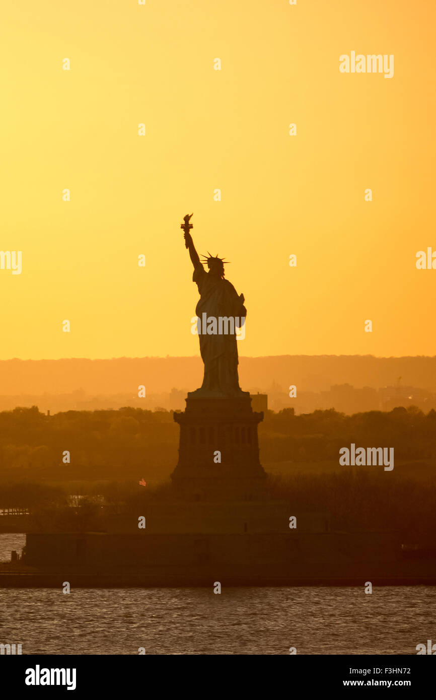 The Statue of Liberty at sunset in New York City, USA Stock Photo - Alamy
