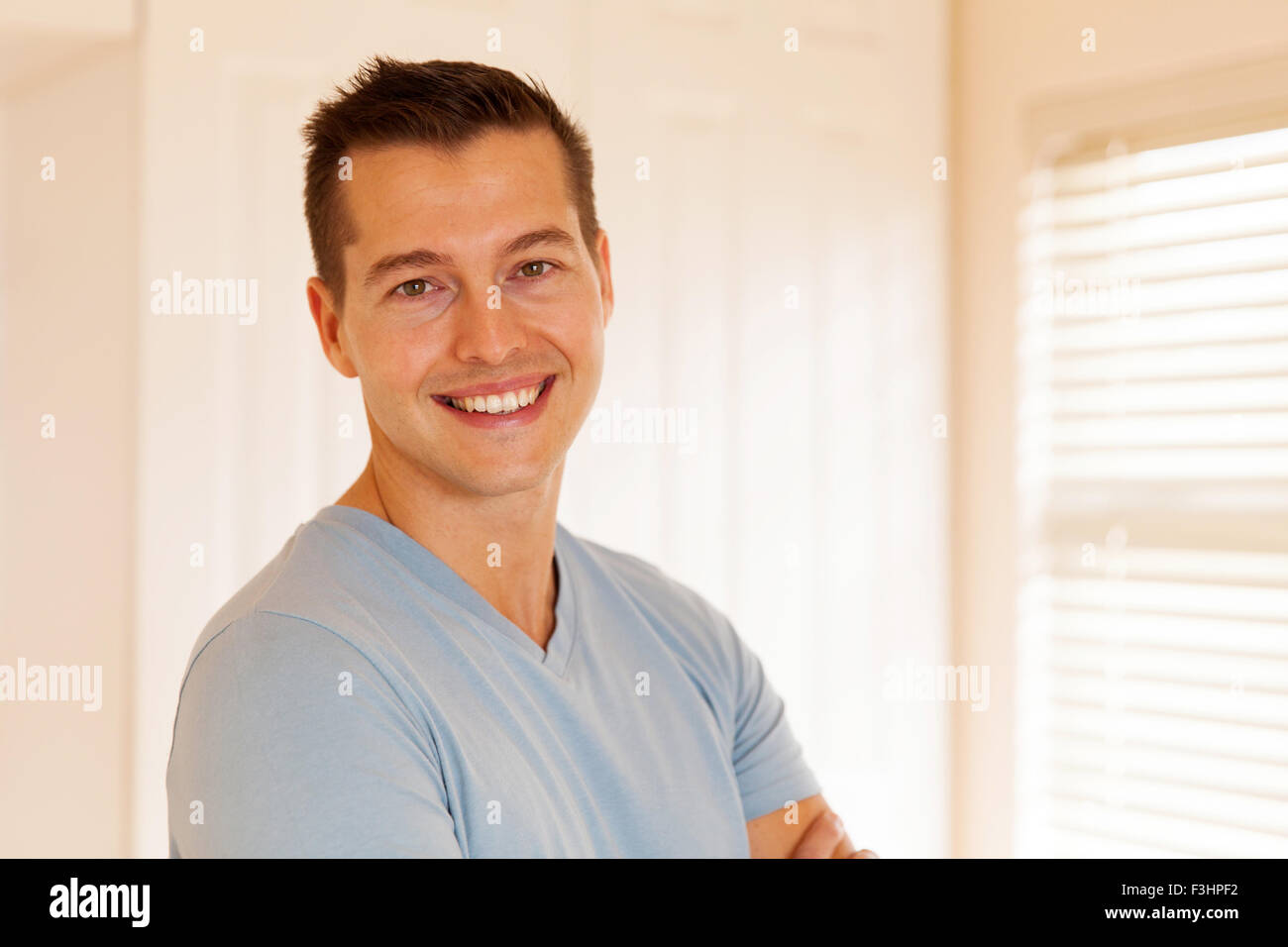 good looking young man in empty house Stock Photo