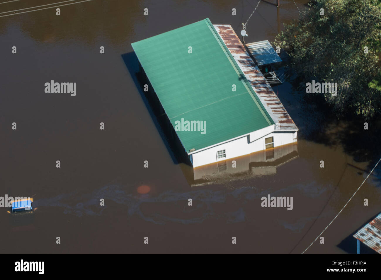 Aerial view of floodwaters submerging a home after record breaking