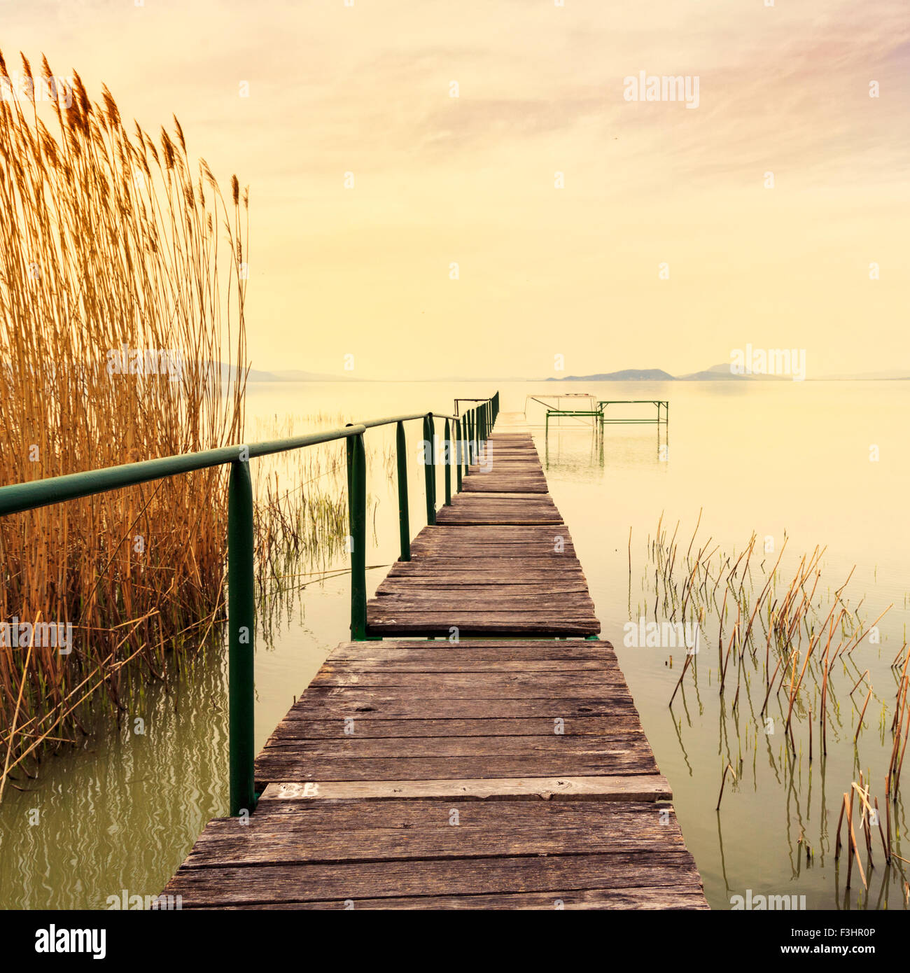 Wooden pier in tranquil lake Balaton-Hungary Stock Photo