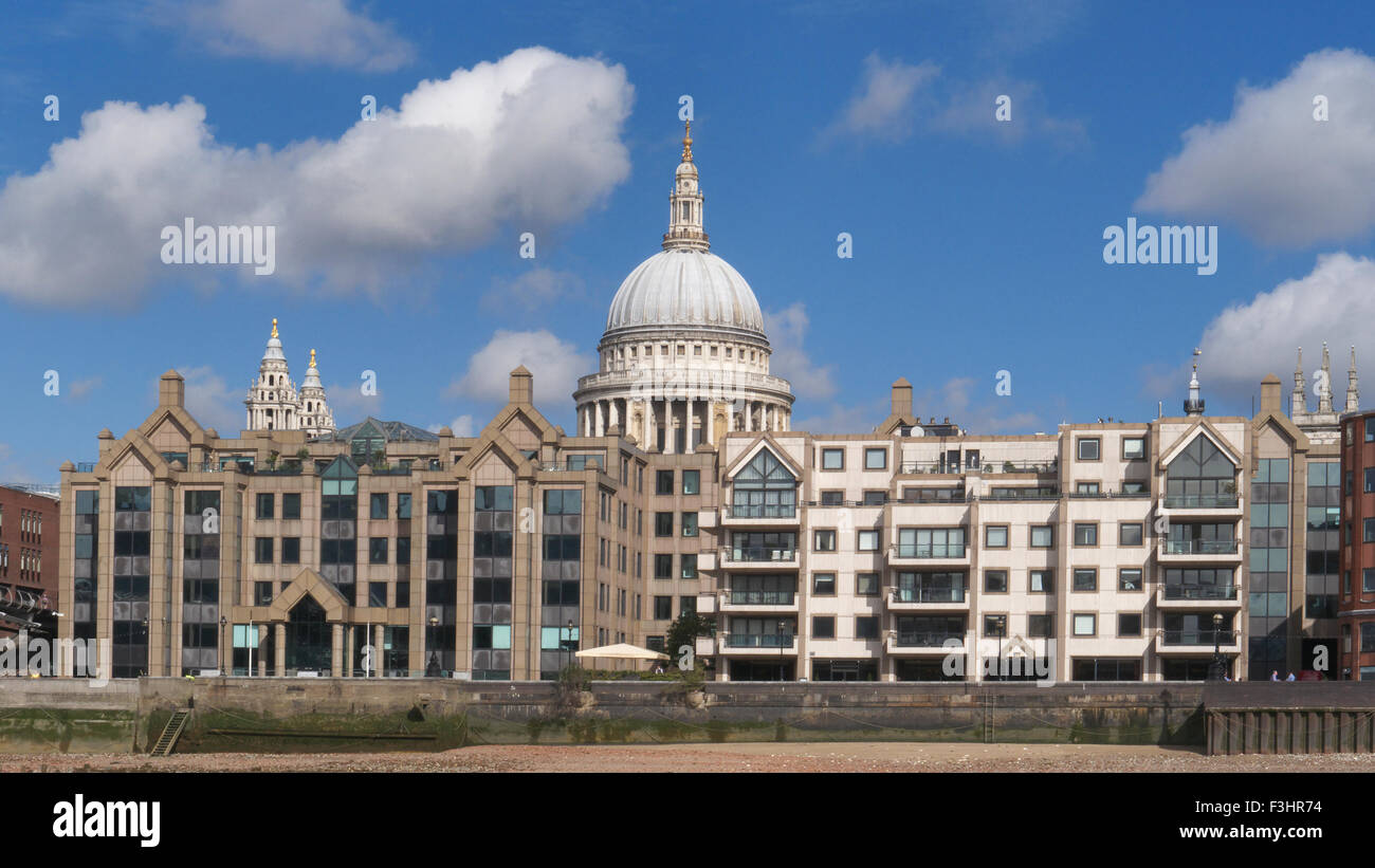 Saint Paul's Cathedral still dominating the horizon with surrounding offices & luxury apartments facing River Thames London EC4 Stock Photo