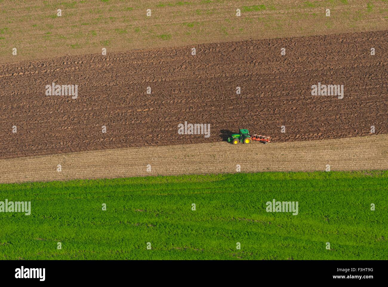France, Bas Rhin (67), Kirchheim, tractor plowing field during autumn (aerial view)  // Bas Rhin (67), Kirchheim, tracteur en la Stock Photo
