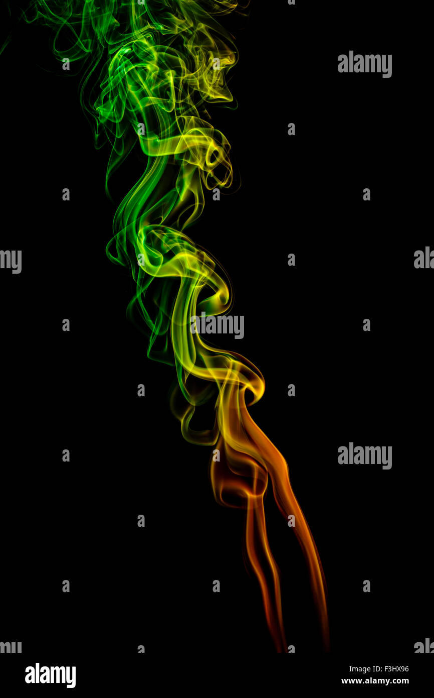 Abstract art. Color yellow - green - orange smoke from the aromatic