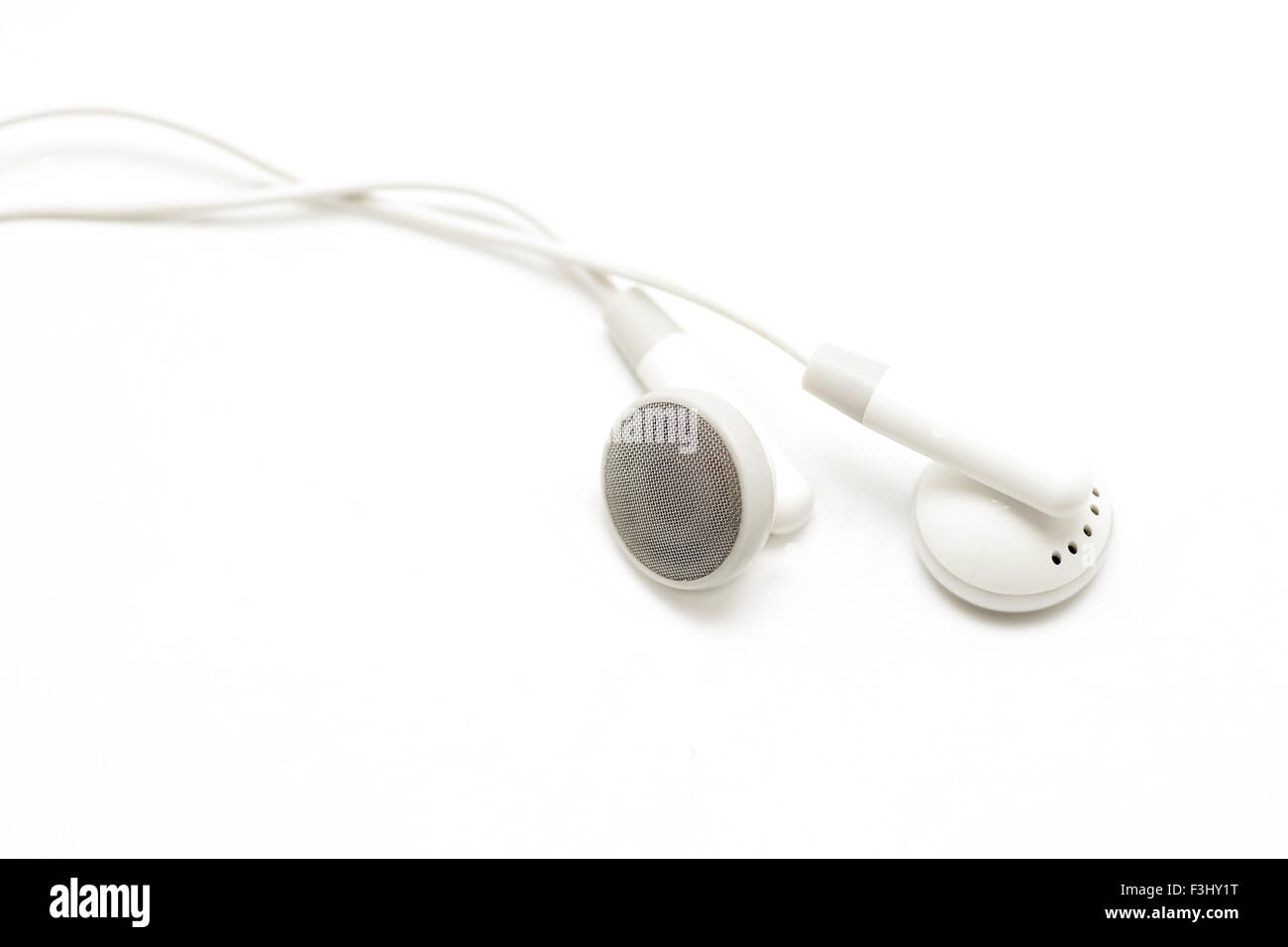 white audio earbuds isolated on white background Stock Photo