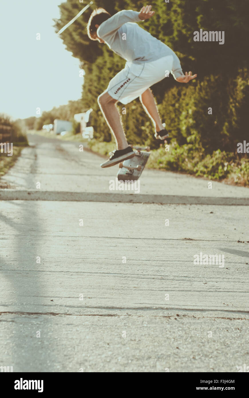 Young man skateboarding in the summer Stock Photo