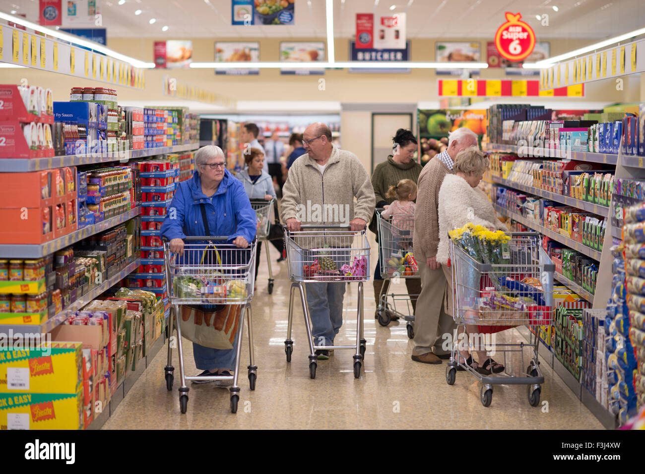 Pensioners shop in an Aldi UK supermarket store on Newport Road, Cardiff. Stock Photo
