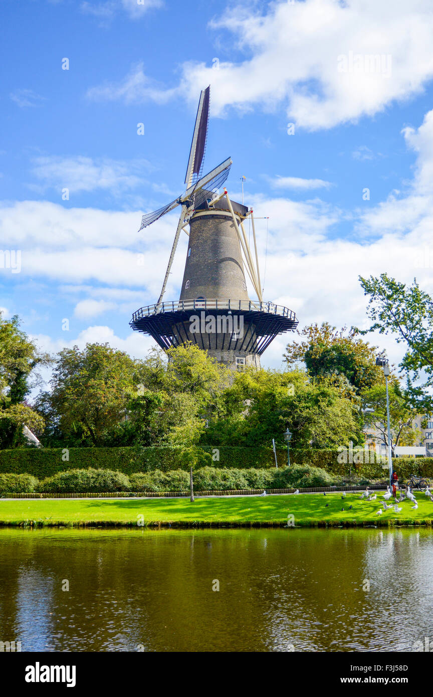 Windmill in Netherlands town Leiden. Idyllic day for being outdoors Stock Photo