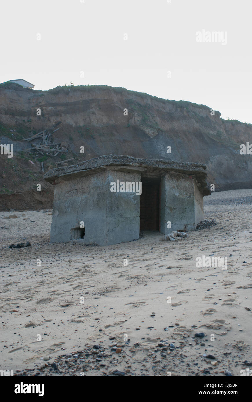 Old pill box on a deserted beach Stock Photo