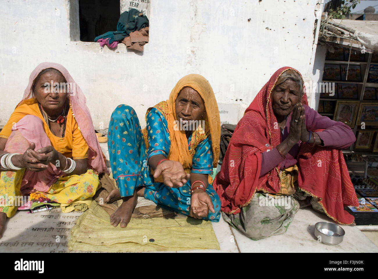 Three lady beggars at Brahmaji ka temple at Pushkar ; Rajasthan ; India Stock Photo
