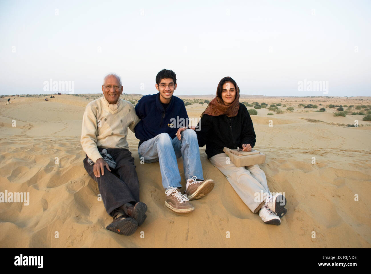 Family at sam sand dunes at Jaisalmer ; Rajasthan ; India NO MR Stock Photo