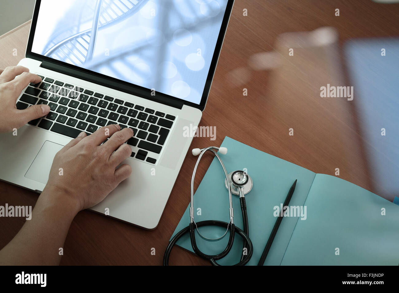 top view of Medicine doctor hand working with modern computer and smart ...