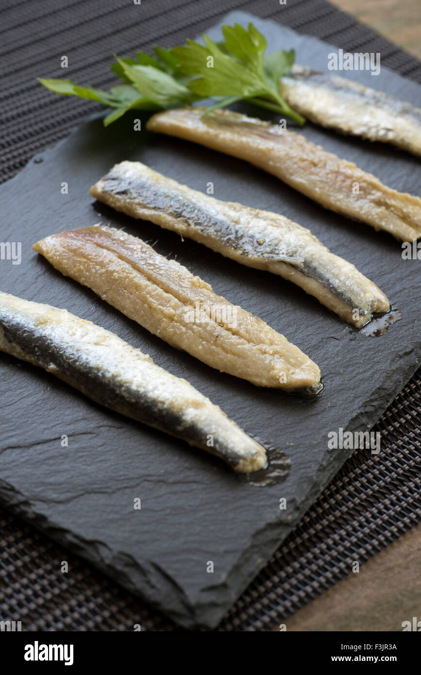 anchovies; parsley; olive oil Stock Photo