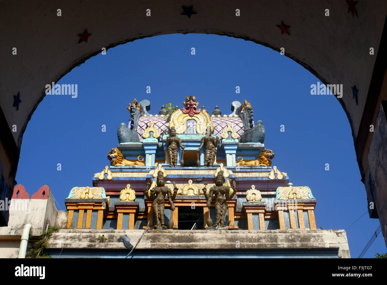 Richly decorated colourfully painted Gopuram Shree Durga Parmeshwari Temple arch Kateel Dakshina Karnataka india Stock Photo
