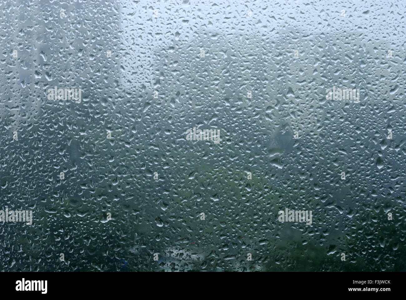 Drops of rain water on window glass Stock Photo