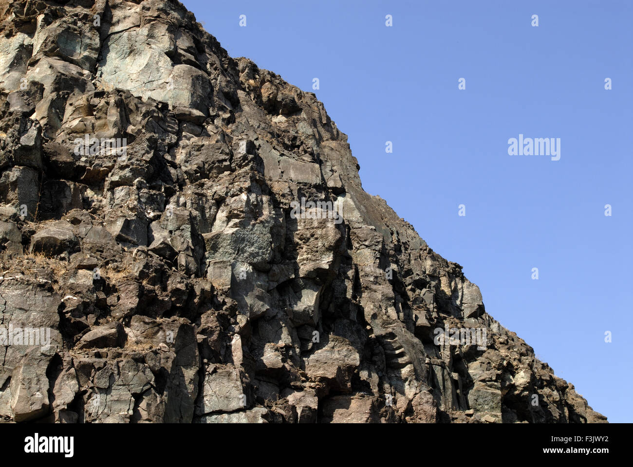 Hill of hard rock at Chilhewadi Otur Taluka Junnar District Pune Maharashtra India Stock Photo