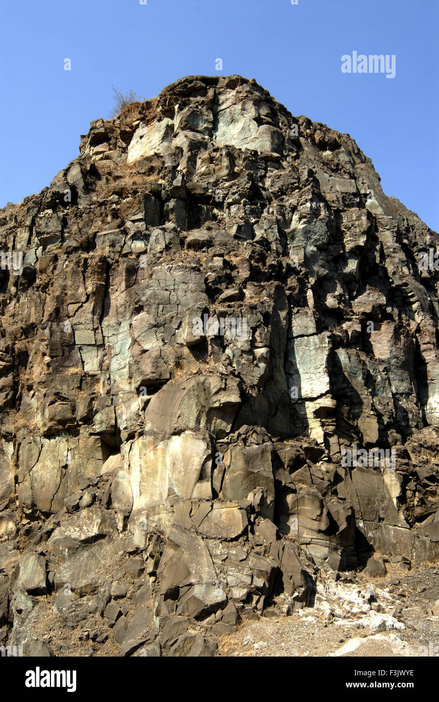 Hill of hard rock at Chilhewadi near village Otur Taluka Junnar District Pune Maharashtra India Stock Photo