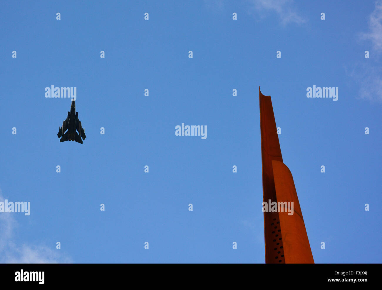 A Tornado overflight by 'MacRobert's Reply' at The International Bomber Command Centre's Memorial Spire, Lincoln. Stock Photo