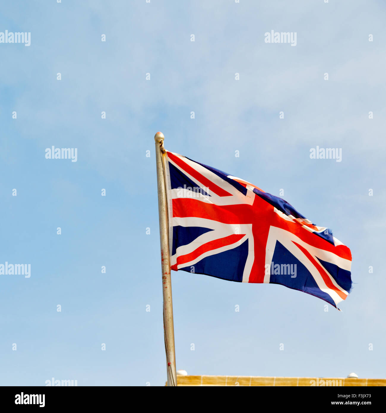 waving flag in the blue sky   british colour and wave Stock Photo