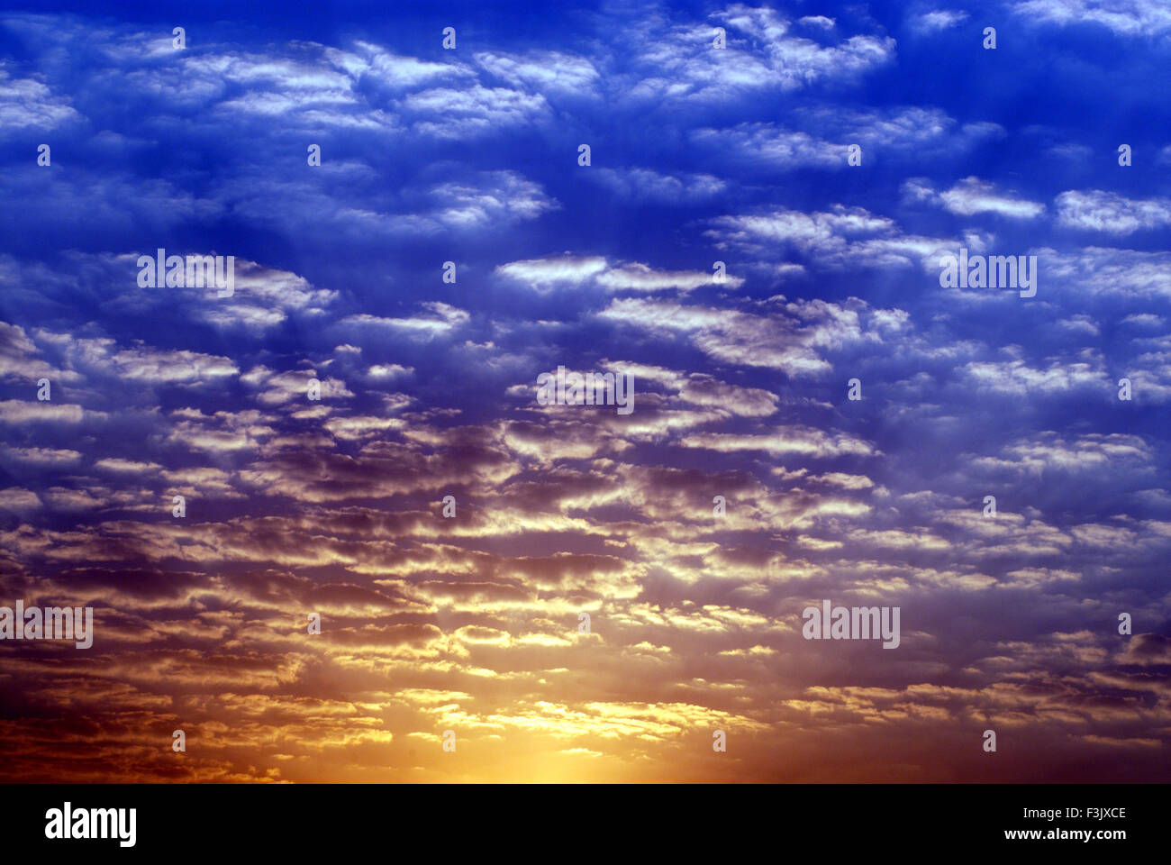 Colorful cloudy sky at Sunrise at Otur ; Taluka Junnar ; District Pune ; Maharashtra ; India Stock Photo