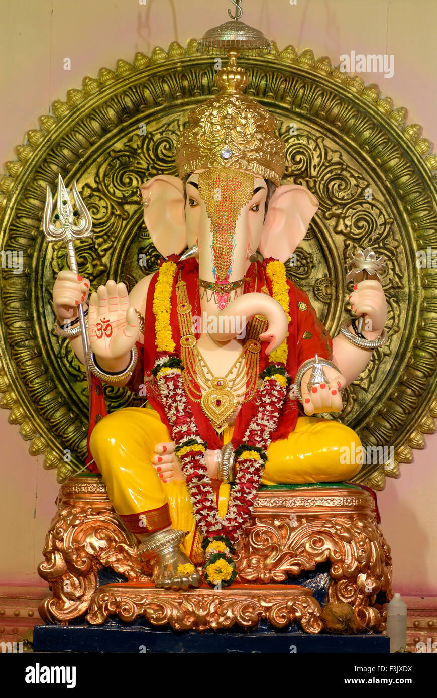 Idol of Lord Ganesh with magnificent and richly illuminated decoration ...