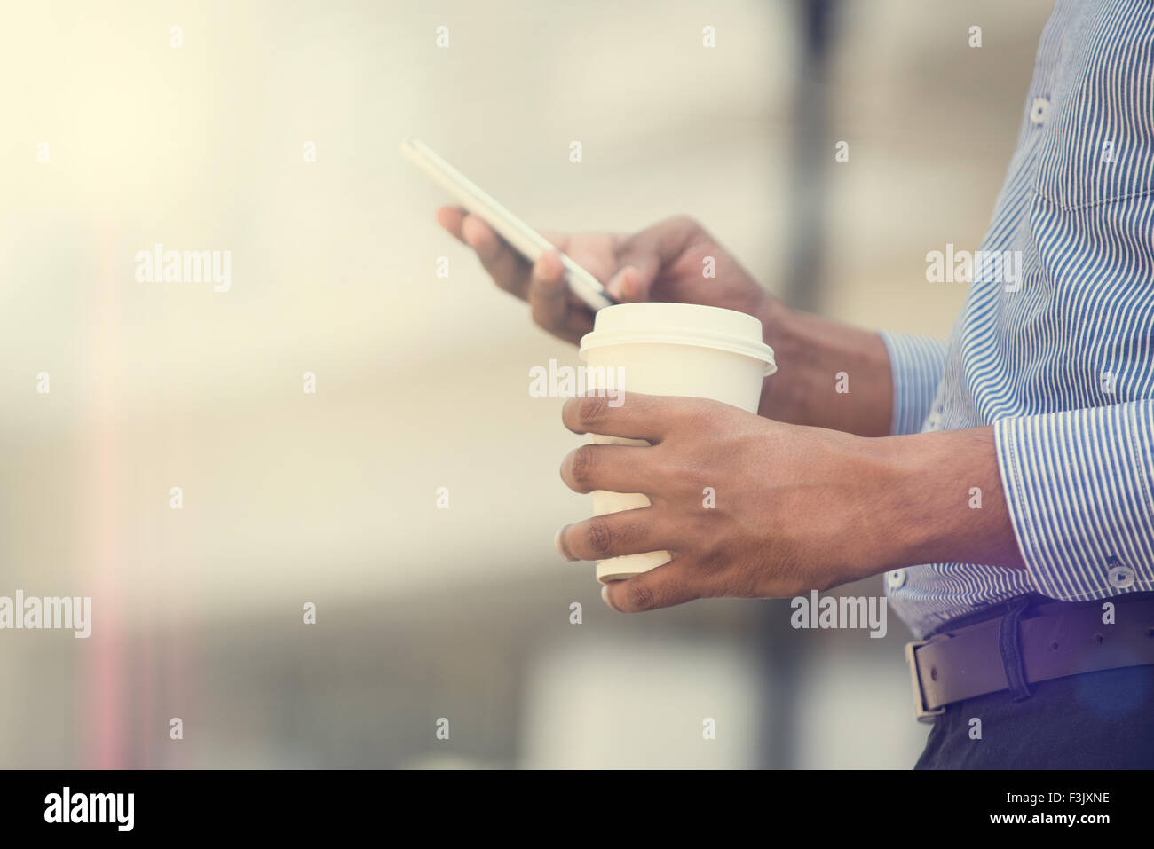 indian business man using phone and coffee in the morning Stock Photo