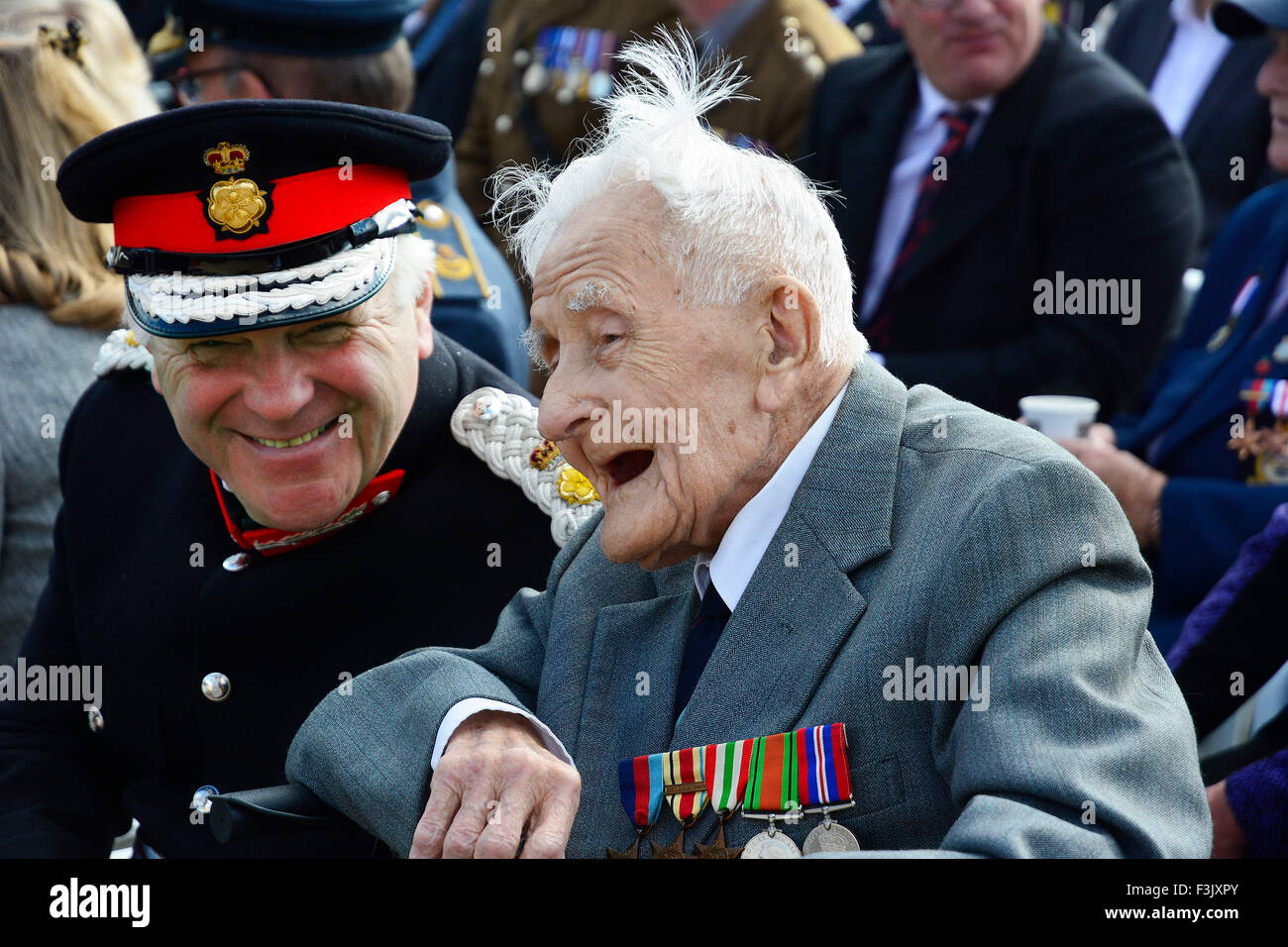 Lord Ltnt. of Lincolnshire, Toby Dennis, shares a joke with the oldest veteran at the event, Flt. Ltnt. Bill Brown,(103),  at The International Bomber Command Centre's Memorial Spire, unveiled at Canwick Hill, Lincoln, 2nd October, 2015. Stock Photo