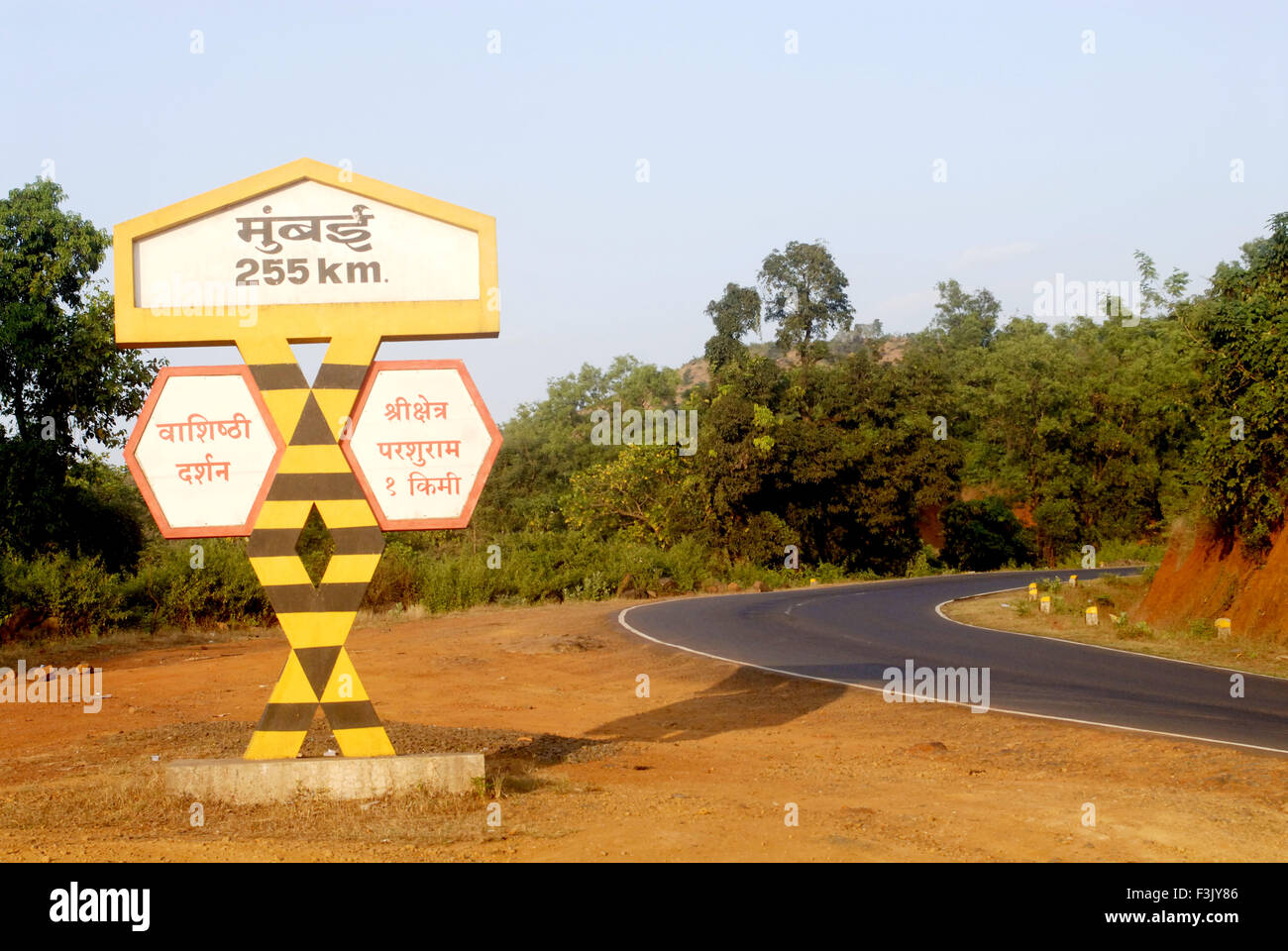 Mumbai 255 kilometer Decorated sign board sharp turn national highway