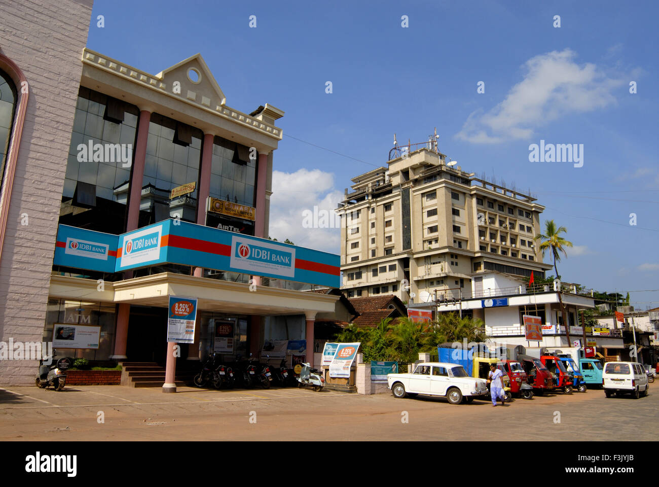 Busy street with modern structures for shops and residence at main city of Udupi Karnataka India Stock Photo