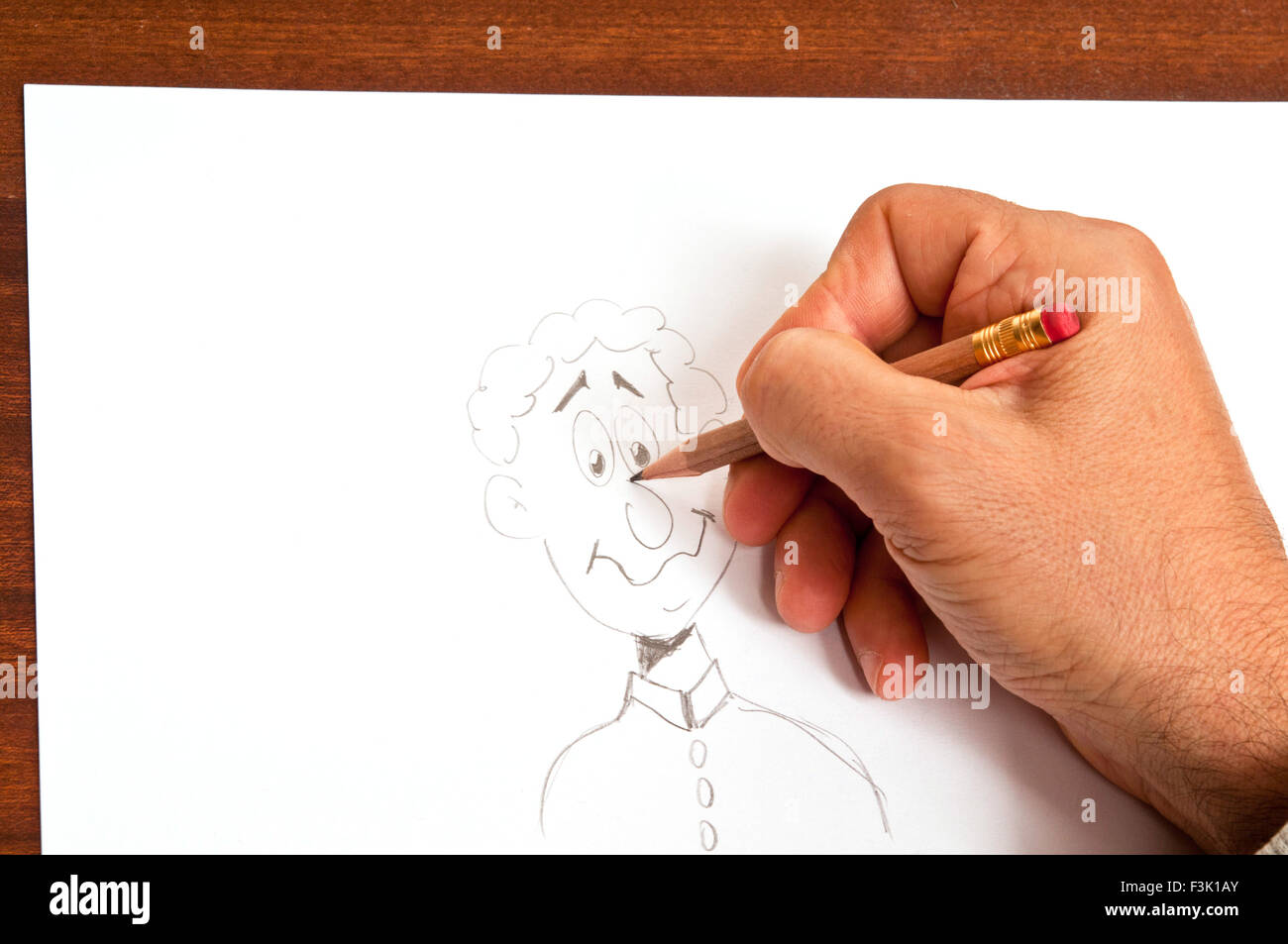 male hand drawing a cartoon figure Stock Photo - Alamy