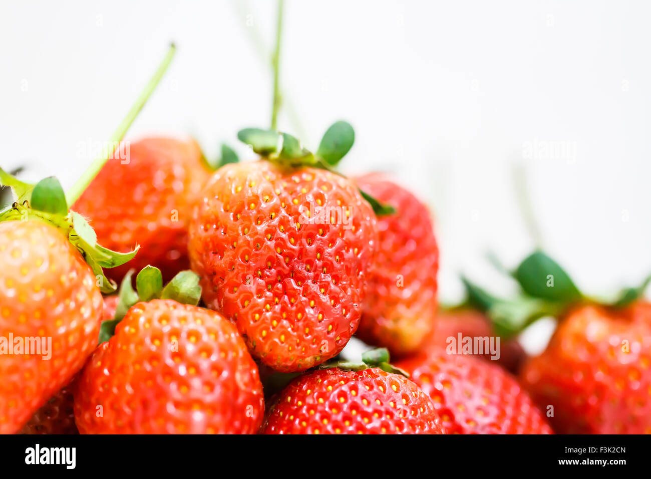 Strawberry berries on a white background Stock Photo - Alamy