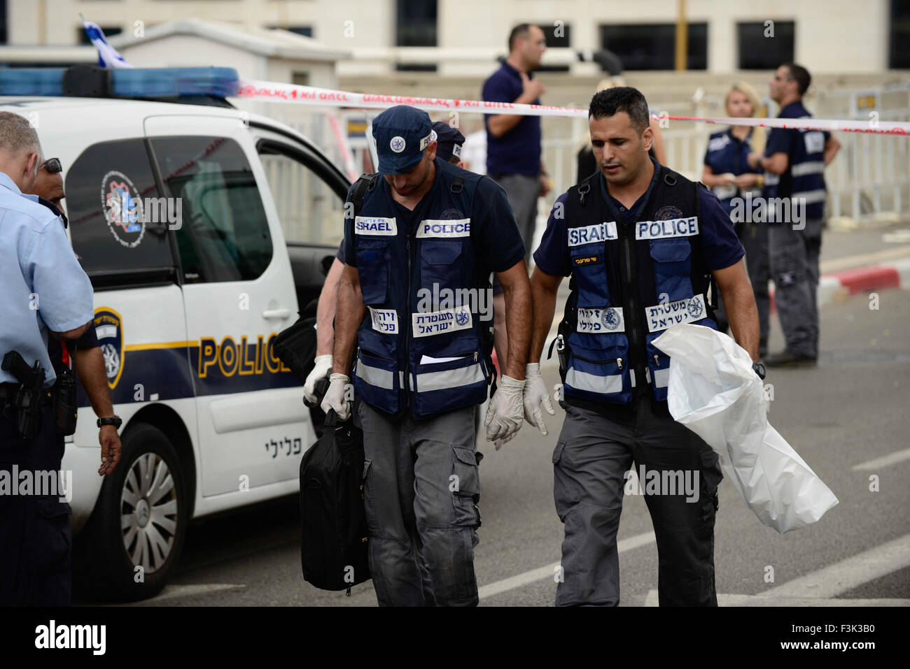 (151009) -- TEL AVIV, Oct. 9, 2015 (Xinhua) -- Israeli policemen work on the scene of an attack in Begin Street, central Tel Aviv, on Oct. 8, 2015. A Palestinian man was shot and killed on Thursday after stabbing two Israelis in Tel Aviv, as violence between Israelis and Palestinians spiraled, Israeli officials said. Police said the incident was a 'suspected terror attack,' and the assailant was 'neutralized.' A police spokesperson later added that the assailant stabbed a female soldier with a screwdriver in Begin Street, near the Defense Ministry and IDF headquarters complex. He then stabbed Stock Photo