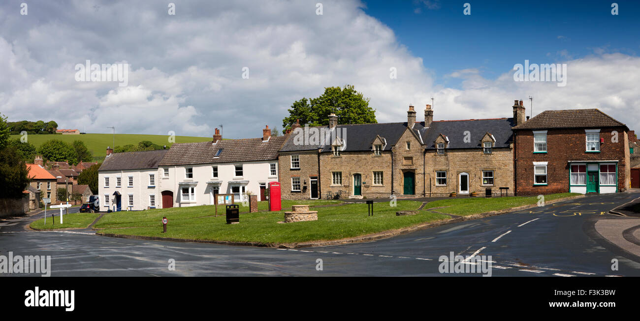 UK, England, Yorkshire East Riding, North Newbold, phone box and houses around village green, panoramic Stock Photo