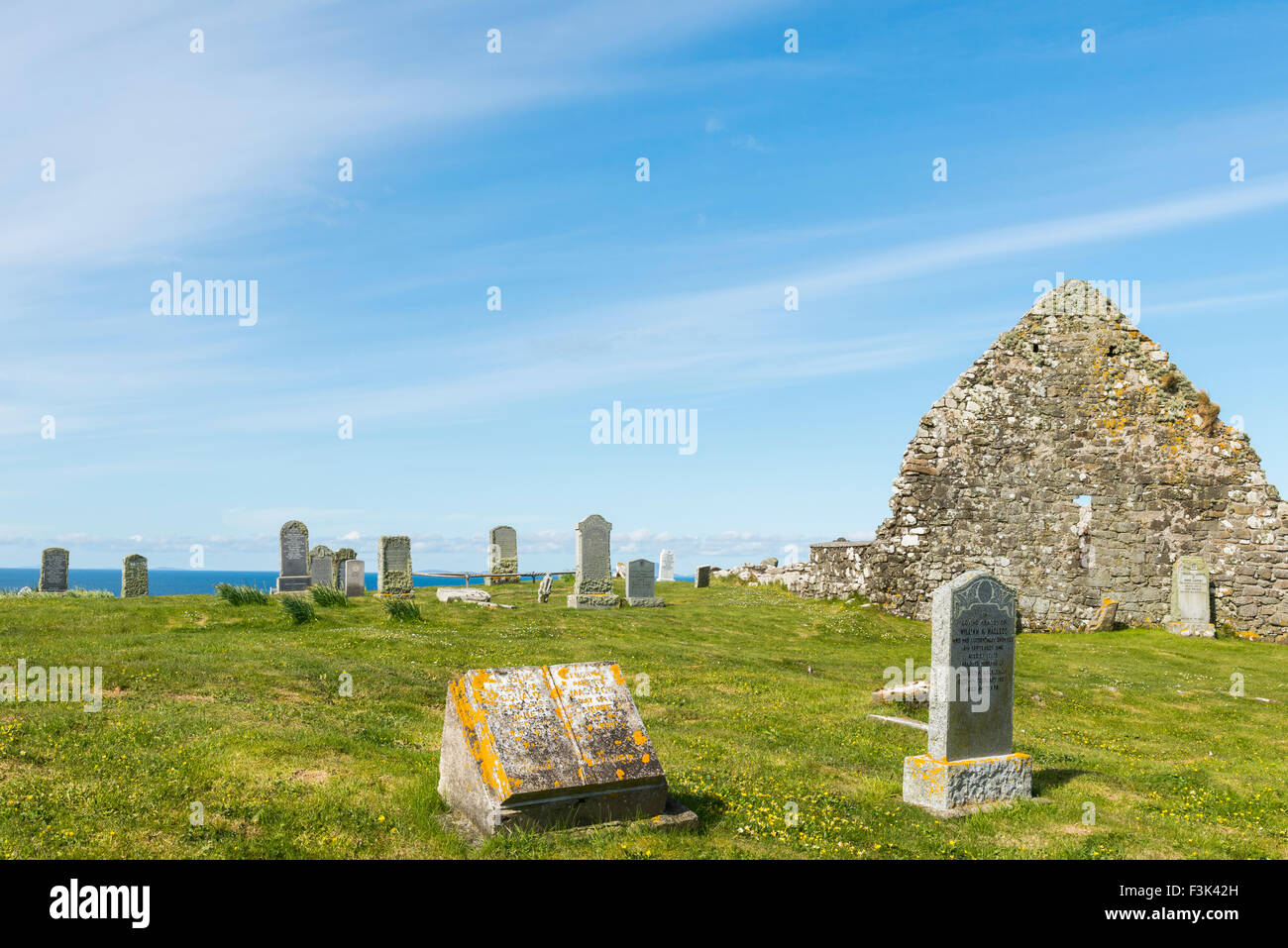 Graveyard on Trumpan with grave stones and old chapel on the Isle of Skye in Scotland. Stock Photo
