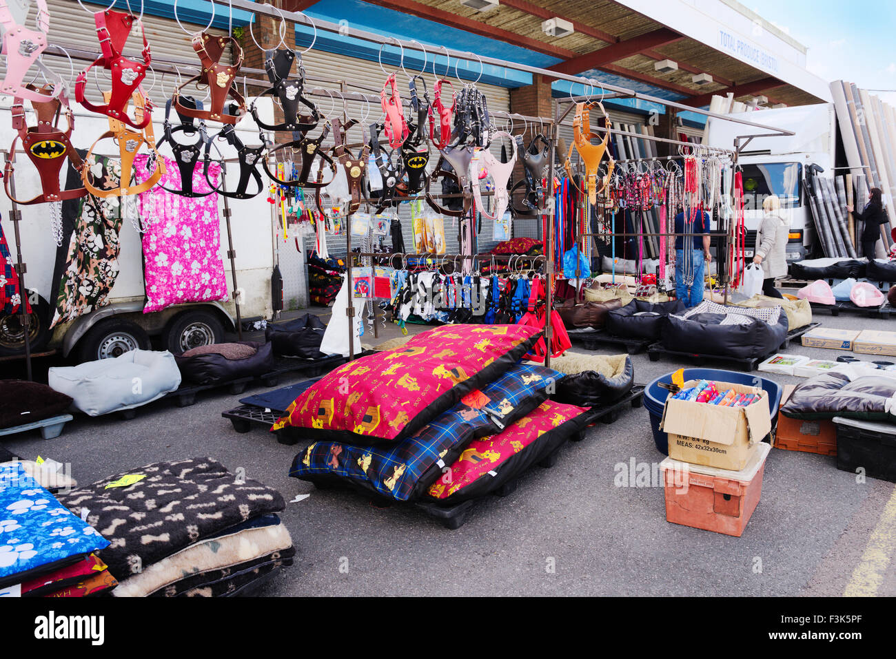Dog harnesses, beds and other accessories for pets in open air market stall Stock Photo