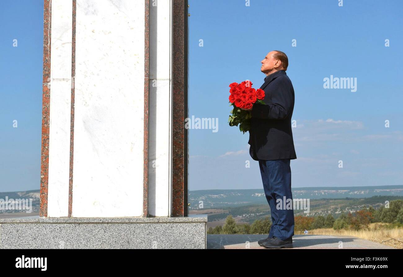 Former Italian Prime Minister Silvio Berlusconi pauses before placing flowers at a memorial to the soldiers from Sardinia killed in the Crimean War, near Mount Gasfort September 11, 2015 in Sevastopol, Crimea. Stock Photo