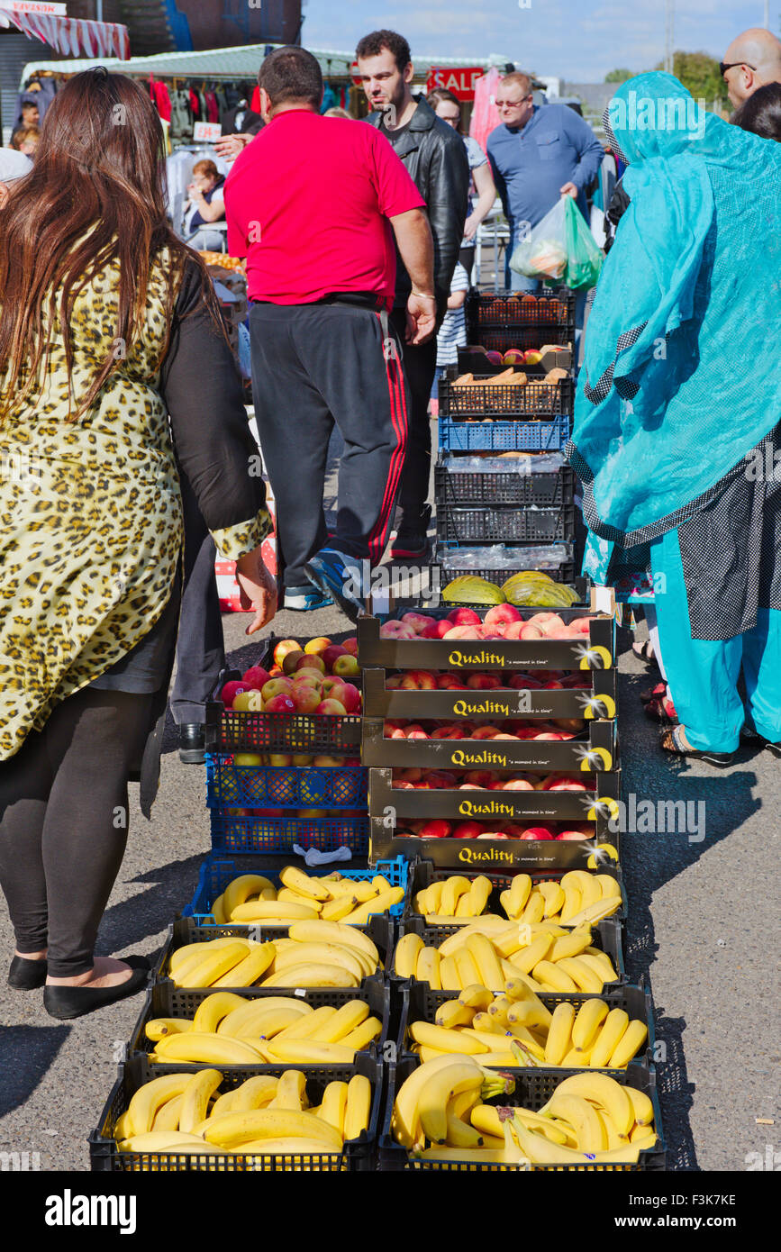 Open air outdoor market stall in Bristol selling bananas, apples, melons Stock Photo