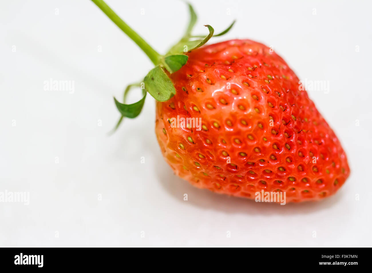 Strawberry berries on a white background Stock Photo - Alamy