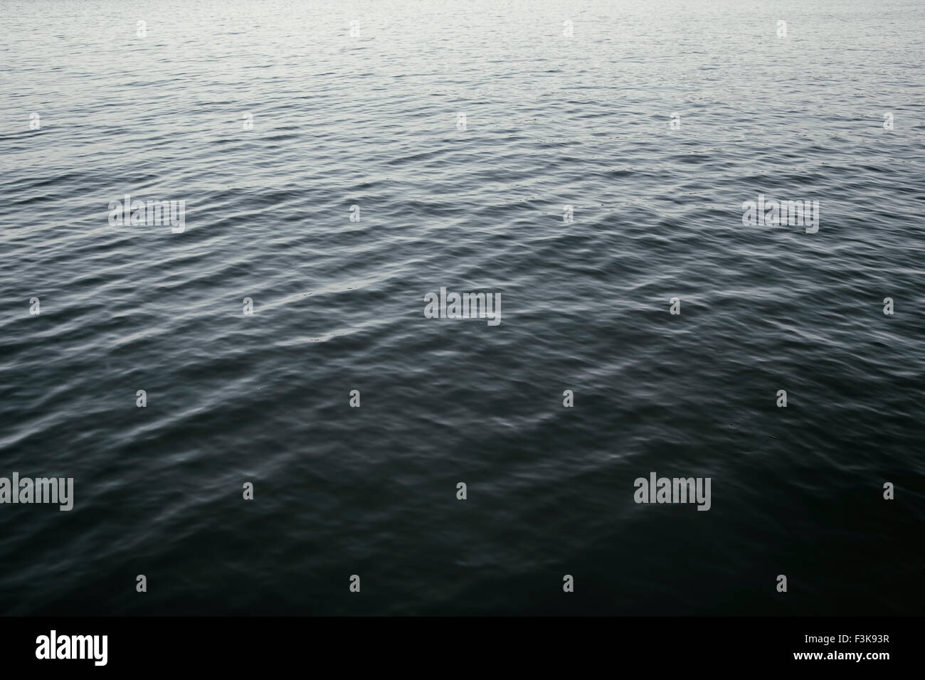 The gently rippled surface of a body of water. Stock Photo