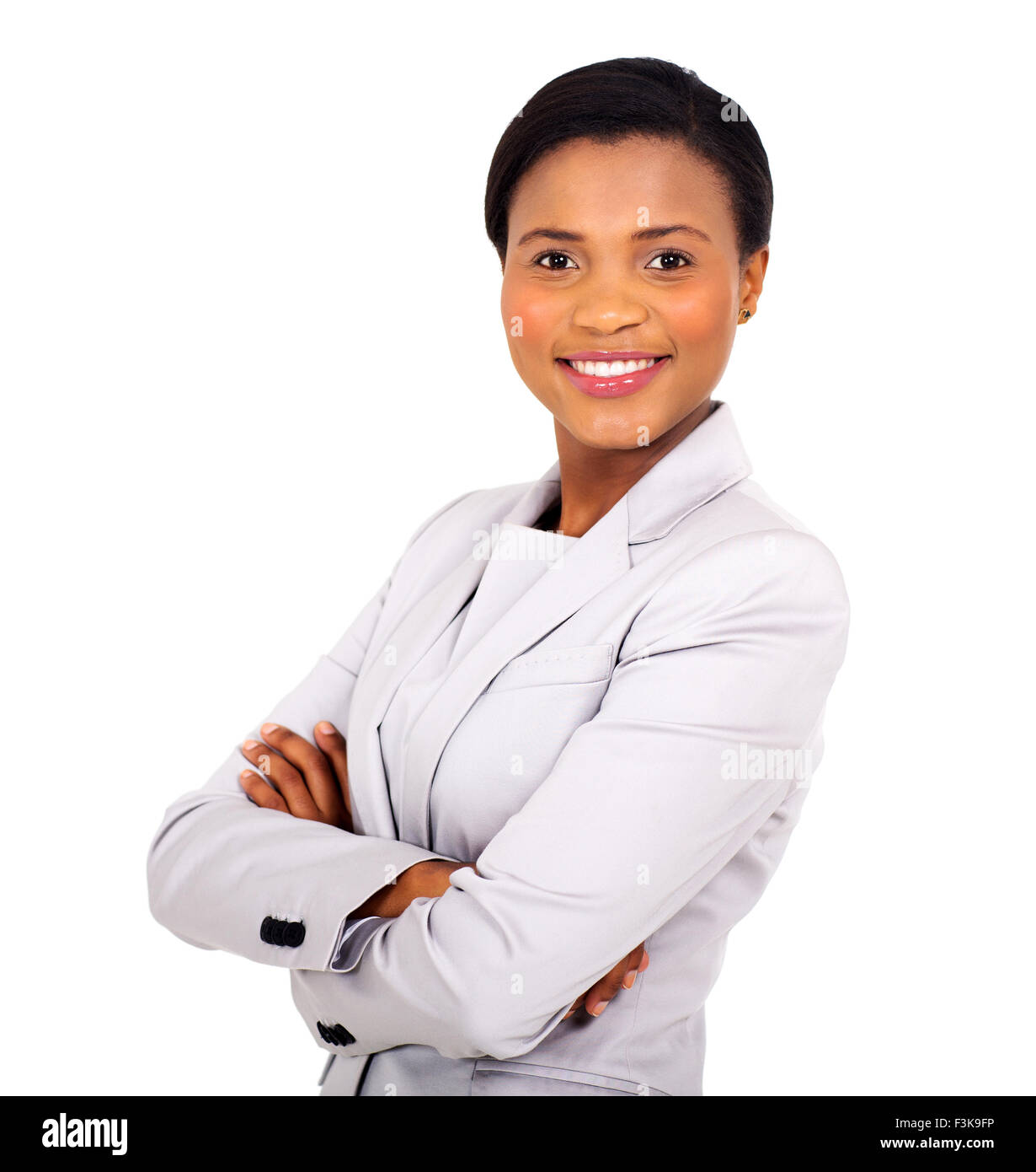 pretty African business woman with arms crossed on white background ...