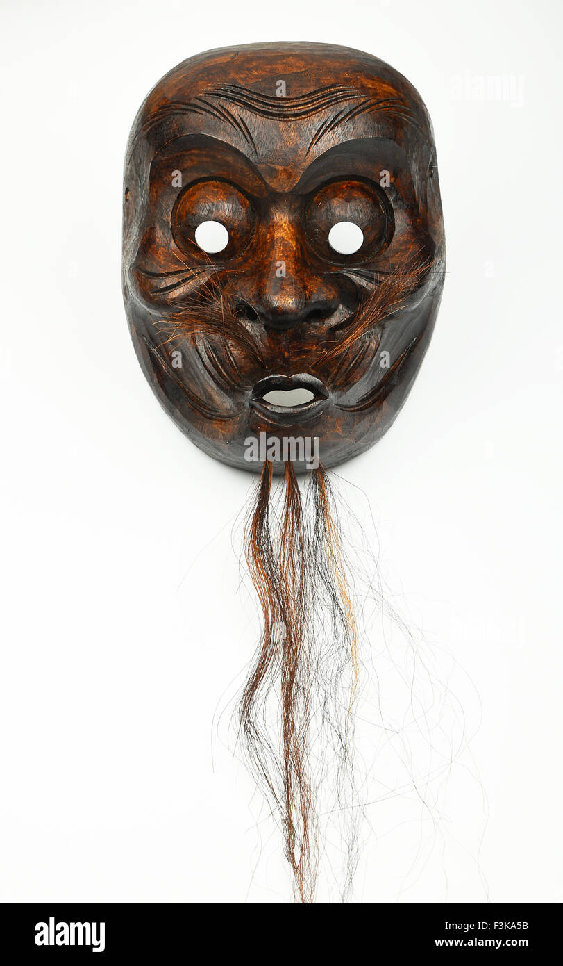 Japanese wooden carved theater mask of human face with beard and moustache  isolated on white background Stock Photo - Alamy