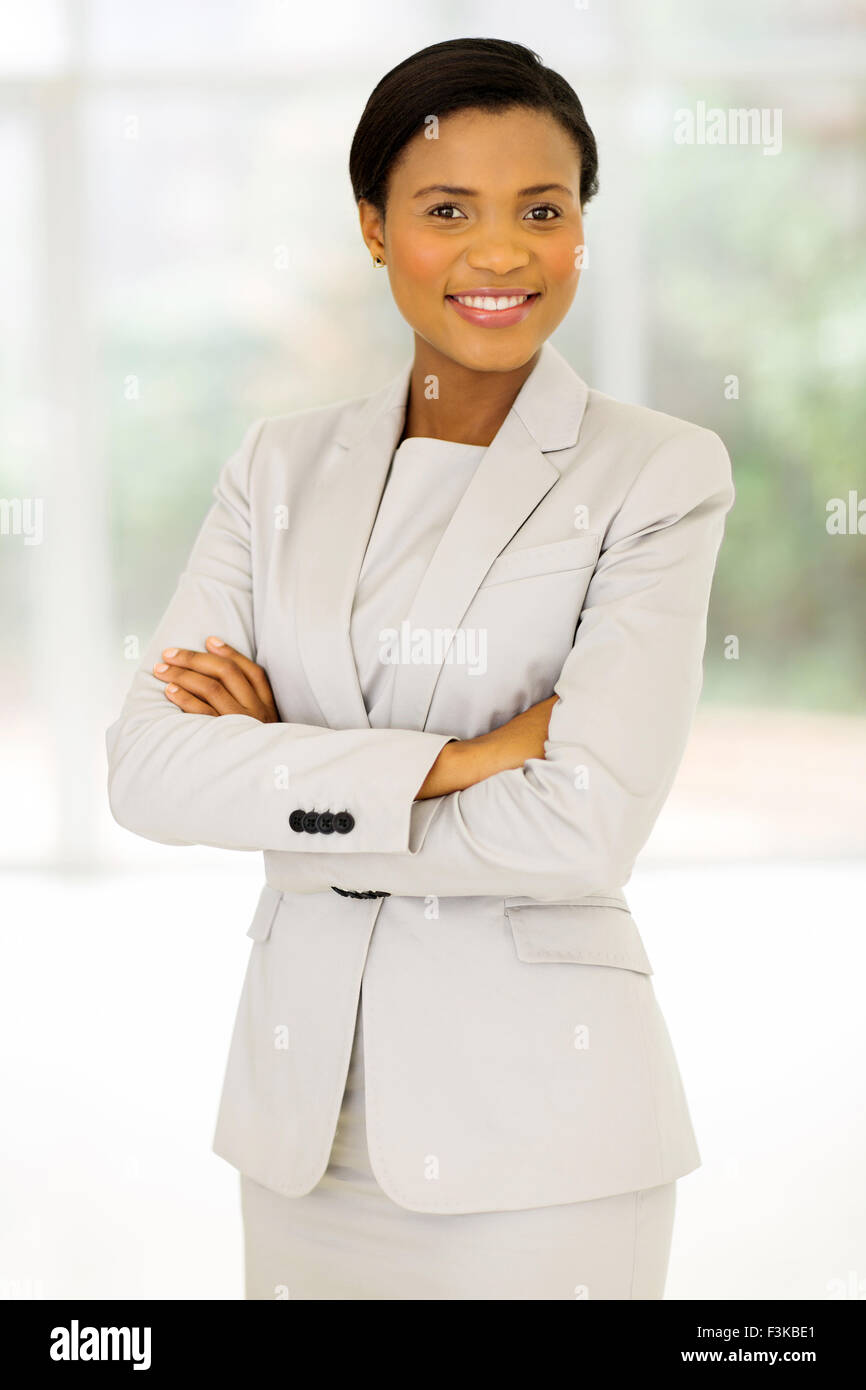 cheerful African entrepreneur with arms crossed in office Stock Photo ...