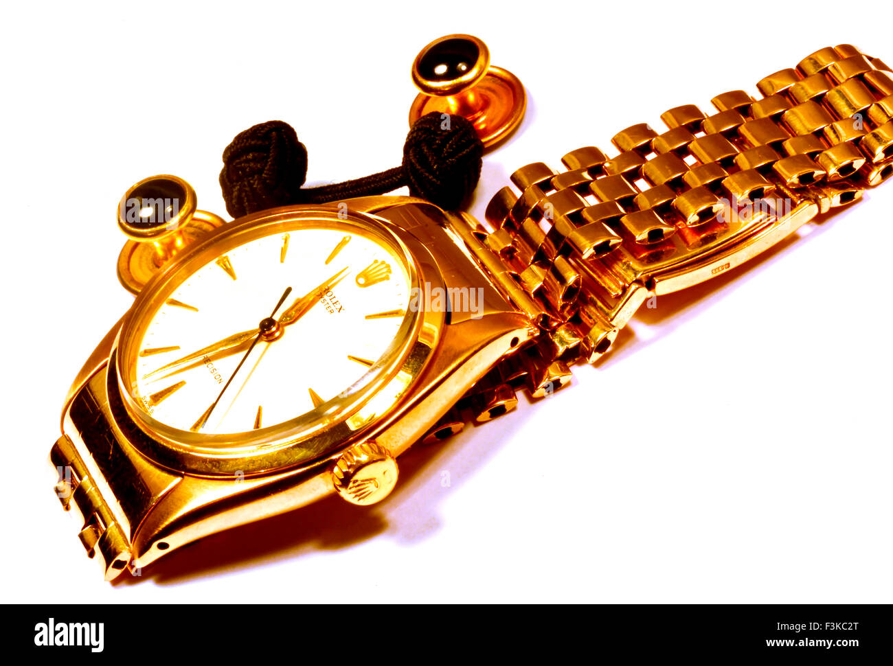 Solid gold Rolex Oyster wristwatch, cufflinks, studs, dress watch, gold,  money, lucre, Swiss, supreme, engineering, quality, ten Stock Photo - Alamy