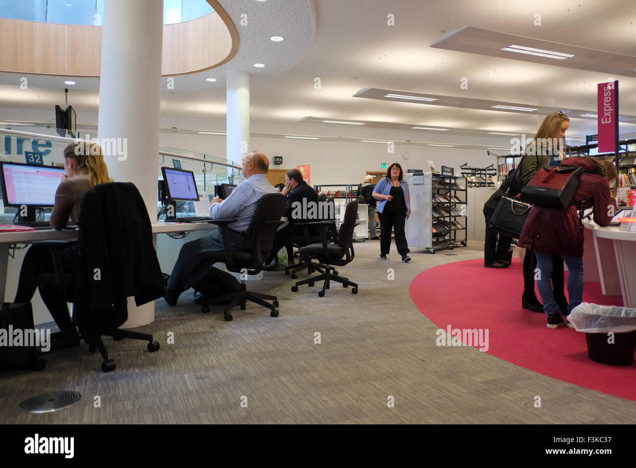 A group of people using computers and laptops to connect to the ...